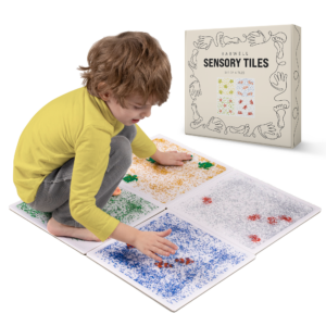 child playing with sensory tiles